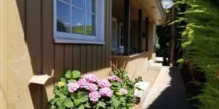 Occupied, do not disturb tenants. 2br duplex with carport and stackable washer/dryer included! Gallery 1