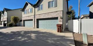 OCTOBER IS FREE!! 3-Bedroom Townhome with 2-Car Garage, Fenced Yard & In-Unit Laundry! Gallery 1