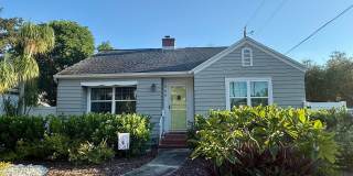 CHARM, CHARACTER & LOCATION — TWO FIREPLACES, BEAUTIFUL HARDWOOD FLOORS & EXPANSIVE OUTDOOR LIVING NEAR CRESCENT LAKE! Gallery 1