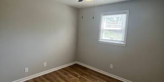 Travelers Rest !! 3 BR, 2 BA with Great Living Space - Den, Bonus Room, Primary Suite has a HUGE walk in Closet, Laundry Room, private screened in porch & deck AND a storage shed out back.  Fresh Paint and New LVP Floors Gallery 13