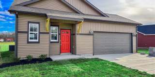 Stylish Home with Feature Stone Front Fireplace, Open Layout and Premium Upgrades Gallery 1