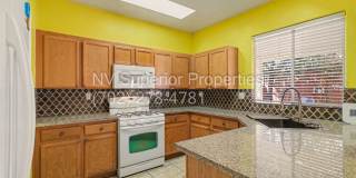 NW!! 4 Bedrooms!!! All Tile and Pergo flooring T/O!! NO Carpet!!! Low Maintenance Desert landscaping front and back!! With Patio cover in back!!! Gallery 18