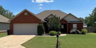 3 Bed, 2 Bath Brick Home with Two-Car Garage, Jetted Tub, and Fenced Yard Gallery 1
