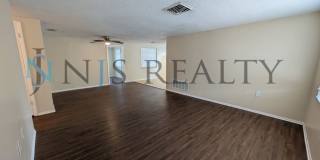 True 3 Bed~2 Bath~with garage. Over 1,000 sq ft, with updated kitchen & bathrooms, large open living space & a fenced in yard!! Gallery 4