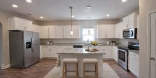 Get ready to fall in love—this sleek, modern beauty in West Creek Farms is bringing the wow factor to Clarksville! Gallery 8