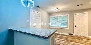 Lovely Three Bedroom Home in KCMO and an Updated Kitchen  w/ Granite and SS Appliances, including a Fenced Yard! Gallery 7