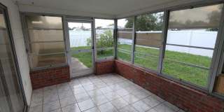 BEAUTIFUL 2/2/1 1000 Sq. Ft. with a large open floorplan, fenced yard and an enclosed lanai!! Gallery 10