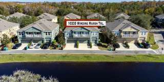 WAKE UP TO PEACEFUL LAKE VIEWS in this spacious 2-bedroom, 2-bath condo with an attached 1-car garage in the desirable East Park community near Lake Nona Gallery 1