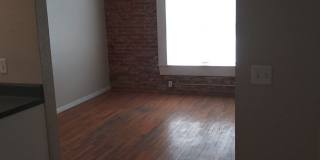 Large windows and exposed brick wall Gallery 7