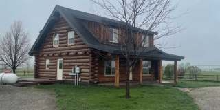 Charming Log Home For Rent with Large Shop & Spacious Yard Gallery 1
