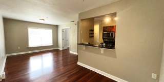MOVE IN NOW!! Gated community Miriada! 1st floor 1X1.5 bath condo near pool area!!! Laminate wood flooring in living area and carpet in bedroom! Has washer & dryer! Gas stove & water heater! Gallery 9