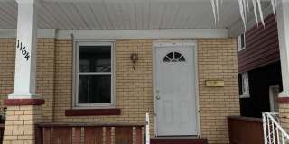 Single Family Home 3 bedroom 1 bath new paint flooring with basement fenced in yard Gallery 1