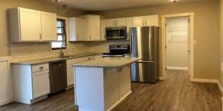 Spacious, stylish, and perfectly located—this beautifully updated 3-bed, 2-bath home near Mercy Hospital offers modern comfort, hardwood floors, and a private fenced yard in the heart of Springfield. Gallery 1