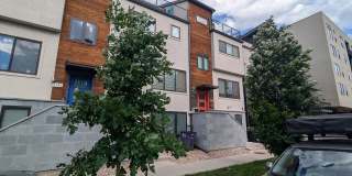 STUNNING 4-LEVEL TOWNHOME IN HIGHLANDS W/ 2-CAR GARAGE +AMAZING ROOFTOP DECK WITH VIEWS! Gallery 1