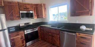 2 Bedroom 1 bath house with extra large double car garage and extra storage space! Gallery 9