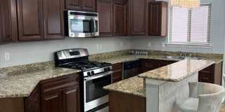 Charming home located in a gated community with access to a community pool. Gallery 4