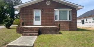 Brick Ranch- Dunn- 4 bedroom 2.5 bath- 2 car carport- Corner Lot Gallery 1