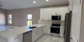 Brand-New Luxury Home with 3-Car Garage & Lawn Care Included | Modern Living in Cape Coral! Gallery 6