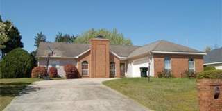 Charming All-Brick Corner Lot Home with Hot Tub  Fenced Yard Gallery 1