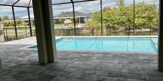 Brand-New Waterfront Luxury in Cape Coral | Heated Pool, Spa, Outdoor Kitchen & 3-Car Garage Gallery 36