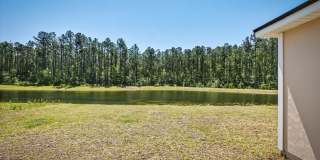 Beautiful Open Layout 4 Bed, 3 Full Bath | A True Masterpiece Backing to a Peaceful Pond with Modern Upgrades + Tesla Charging Gallery 35