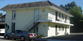 Ideal first floor unit! 2 bedrooms, 1 bathroom! Directly across from beautiful Lake Alhambra. Private covered parking. Community laundry room. SECTION 8 FRIENDLY! Gallery 1