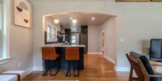 Completely remodeled like new Gingerbread midtown cottage with gleaming hardwoods, converted from a 3/1 to a 3/2. Gallery 21