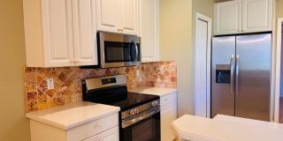Experience Bell Tower Park. GATED ground floor 2 Bed 2 Bath Den 1 Car Garage Condo. Gallery 15