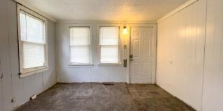 Fall into this cozy 3-Bedroom Home with a fenced in yard & detached garage! Gallery 4