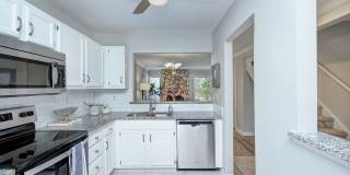 Discover this beautifully updated Raintree townhome featuring an open floor plan and a range of contemporary enhancements. Gallery 8
