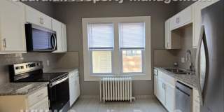 Large main floor duplex unit, Updated Kitchen & Bath, Full Dining Room w/Built-ins + Sunroom, garage stall Gallery 13