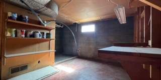 Bi-Level House w/ Massive Backyard, Storage, & Character! Gallery 18