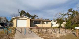 JUST REDUCED!!! Large 2/2/1 1060 sq ft home with INDOOR LAUNDRY, a full garage, updated kitchen and a fenced in yard!! Gallery 1