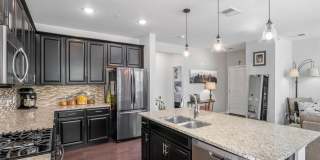 Like new gorgeous ground level Condo with Detached Garage and open floor plan. Gallery 16