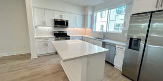 Gorgeous, 3 level townhome, featuring 2 car garage central Air, and in Unit laundry. Gallery 1