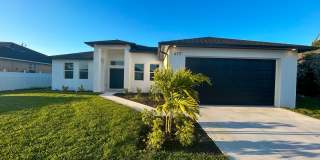 Stunning New Construction Home in Desirable Cape Coral Neighborhood - Modern Design, Spacious Layout, and High-End Features Throughout Stunning New Construction Home in Desirable Cape Coral Neighborhood - Modern Design, Spacious Layout, and High-End Features Throughout Gallery 1