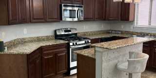 Charming home located in a gated community with access to a community pool. Gallery 5