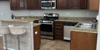 Charming home located in a gated community with access to a community pool. Gallery 11