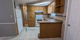Must See 3/2/1 over 1000sf with tile/laminate floors, fresh paint, fenced yard and large living room!! Must See 3/2/1 over 1000sf with tile/laminate floors, fresh paint, fenced yard and large living room!! Gallery 6