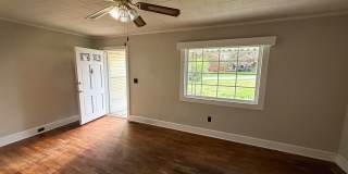 Spacious 2 Bed House | Private Patio + Sliding Door Dining Area Gallery 1