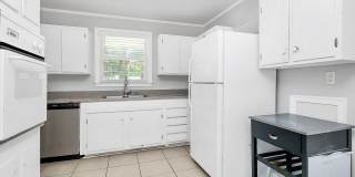 Discover the charm of this brick ranch nestled in the heart of Madison Park Gallery 12