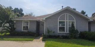 LOVELY 3/2 w/ Screened Porch, New Carpet in Bedrooms, Washer/Dryer, & Privacy Fenced Yard! Includes Lawn Maint! $1575/month Avail NOW! Gallery 1