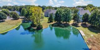 {15914} Lake Front Lenexa Townhome + Maintenance Provided Community + Two Car Garage Gallery 1