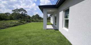 MODERN BRAND NEW RETREAT IN LEHIGH ACRES! Gallery 1