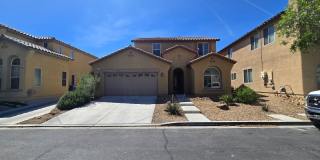 Step outside to a spacious, larger-than-average Las Vegas backyard complete with lush artificial turf, a covered patio, and a pergola Gallery 1