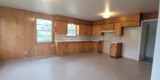 Huge 3 bedroom/1 bath upstairs apartment with Water, Gas Range and Refrigerator! Gallery 1