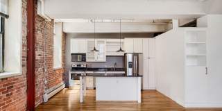 Evolve Real Estate: Bright Industrial-Style 1BD/1BA Condo in LoDo, Nearly 1,160 Sq Ft, Balcony and Rooftop Views! Gallery 3