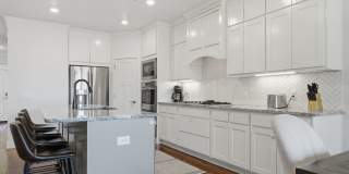 Stunner! This beautiful home features a spacious open floor plan with primary suite and private office on 1st level. Gallery 17