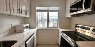 Updated 2-Bedroom Condo with Water Views, 2 Parking Spaces & Poolside Location Gallery 4