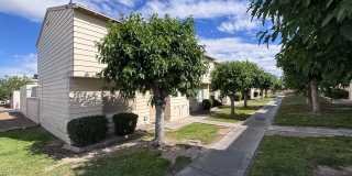 Desirable End-Unit Townhome with 2-Car Garage & Private Courtyard Gallery 1